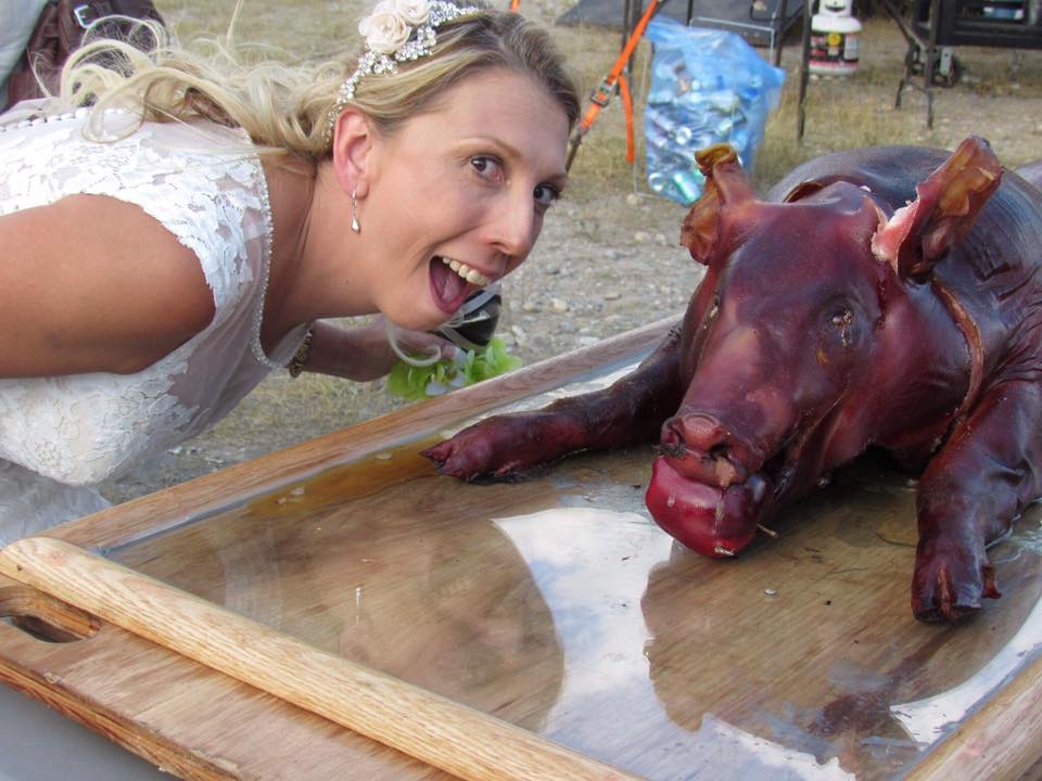 Bride Posing with Smoked Hog